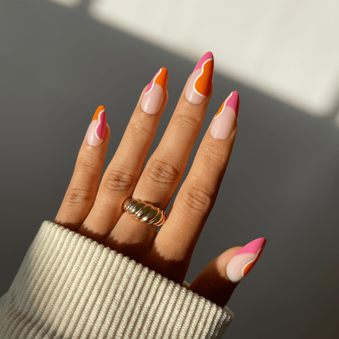 Vibrant DANA press-on nails with summer orange and coral design.