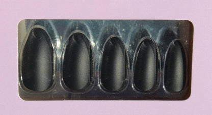 Set of black almond press-on nails in tray