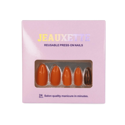 Jeauxette reusable press-on nails packaging with orange and black nails