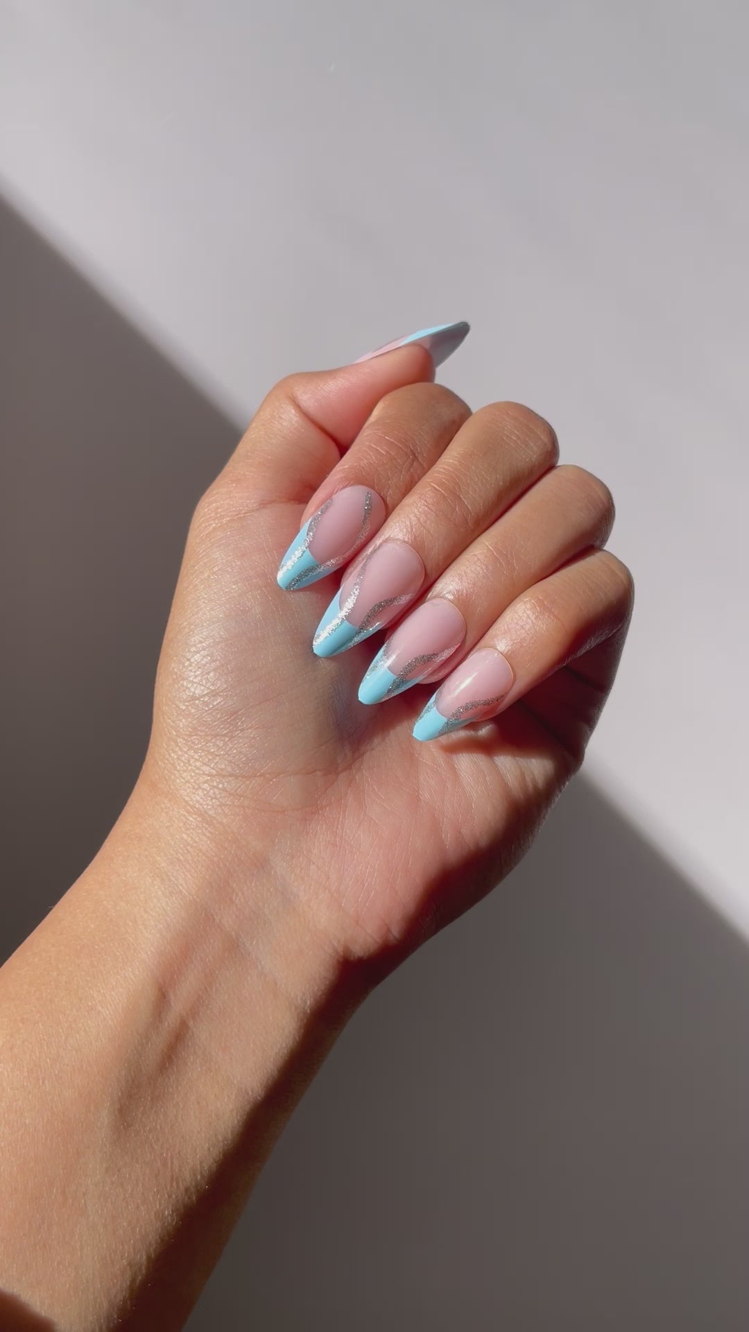 Close-up of SKYE sky blue press-on nails