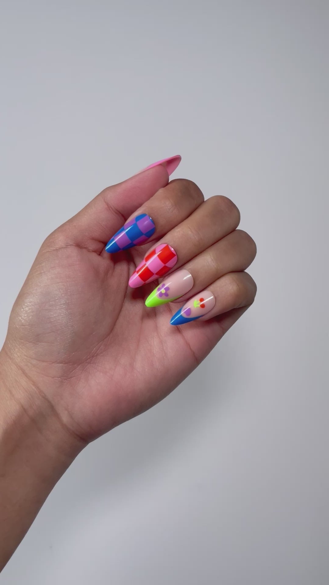 Multi-colored press-on nails for a fun summer look