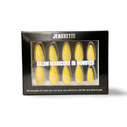 Aurelia yellow almond press-on nails in packaging